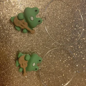 Imperfect frog playing guitar hoop earrings